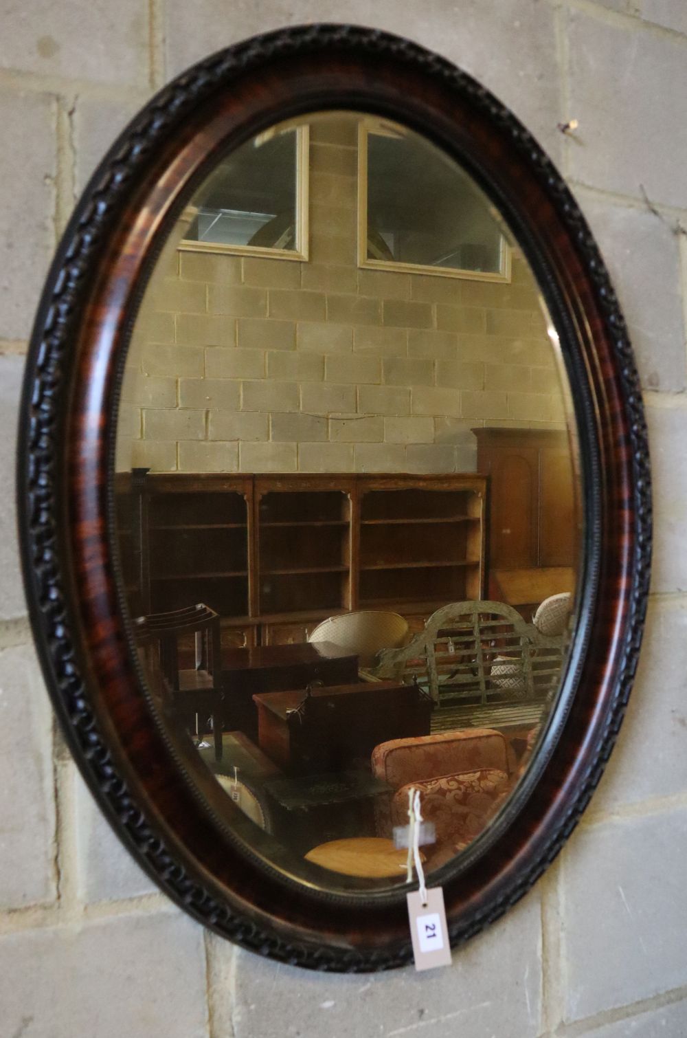 An early 20th century oval wall mirror, height 88cm